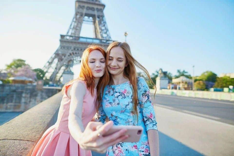 Eiffel Tower: Entry Ticket + Summit Access by Elevator Two tourists taking a selfie at the Eiffel Tower