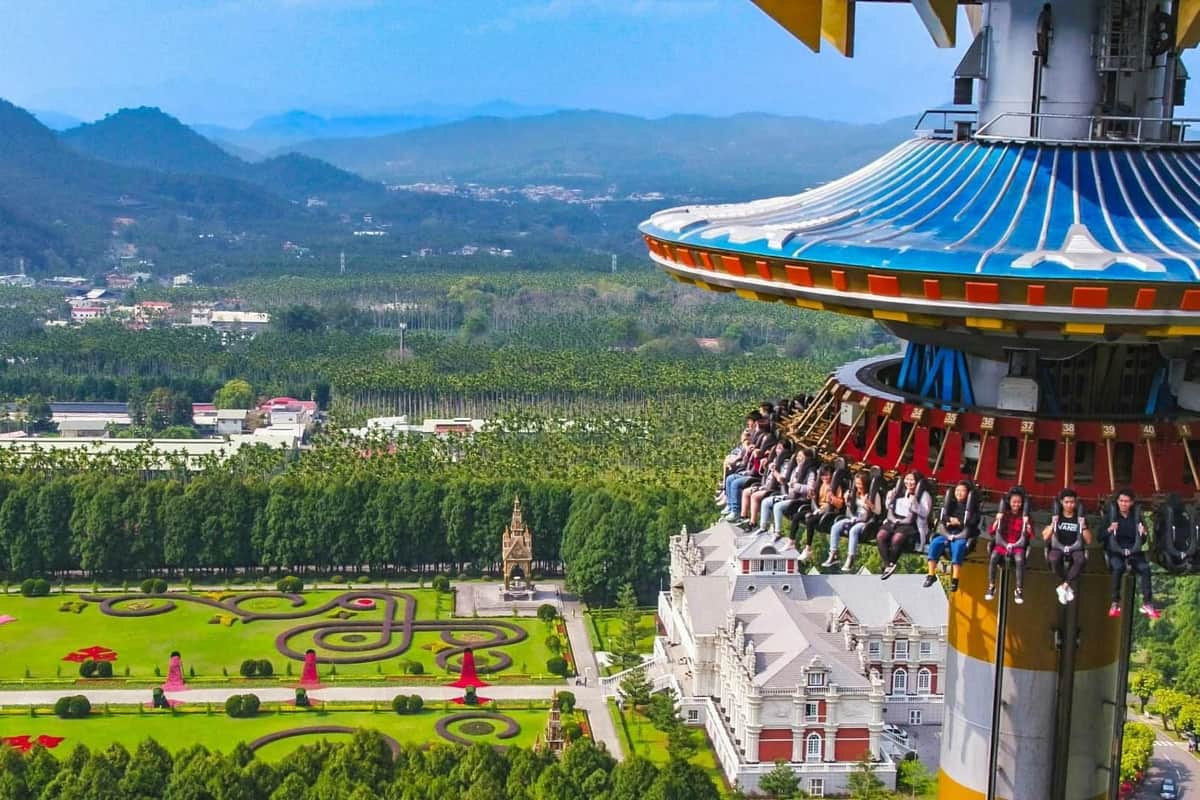Formosan Aboriginal Culture Village: One-Day Ticket with Sun Moon Lake Ropeway + Nantou Gift Purple lavender flowers in the foreground with a white horse statue and green trees in the background.