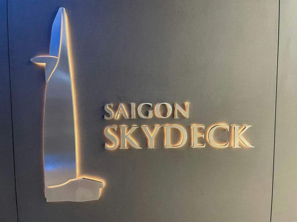 Saigon Skydeck: Entry Ticket Sign with illuminated text reading 'Saigon Skydeck' and a stylized depiction of a building.
