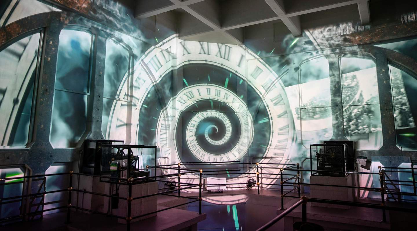 Royal Liver Building A room with a spiral clock face projection on the walls and various mechanical structures encased in glass.